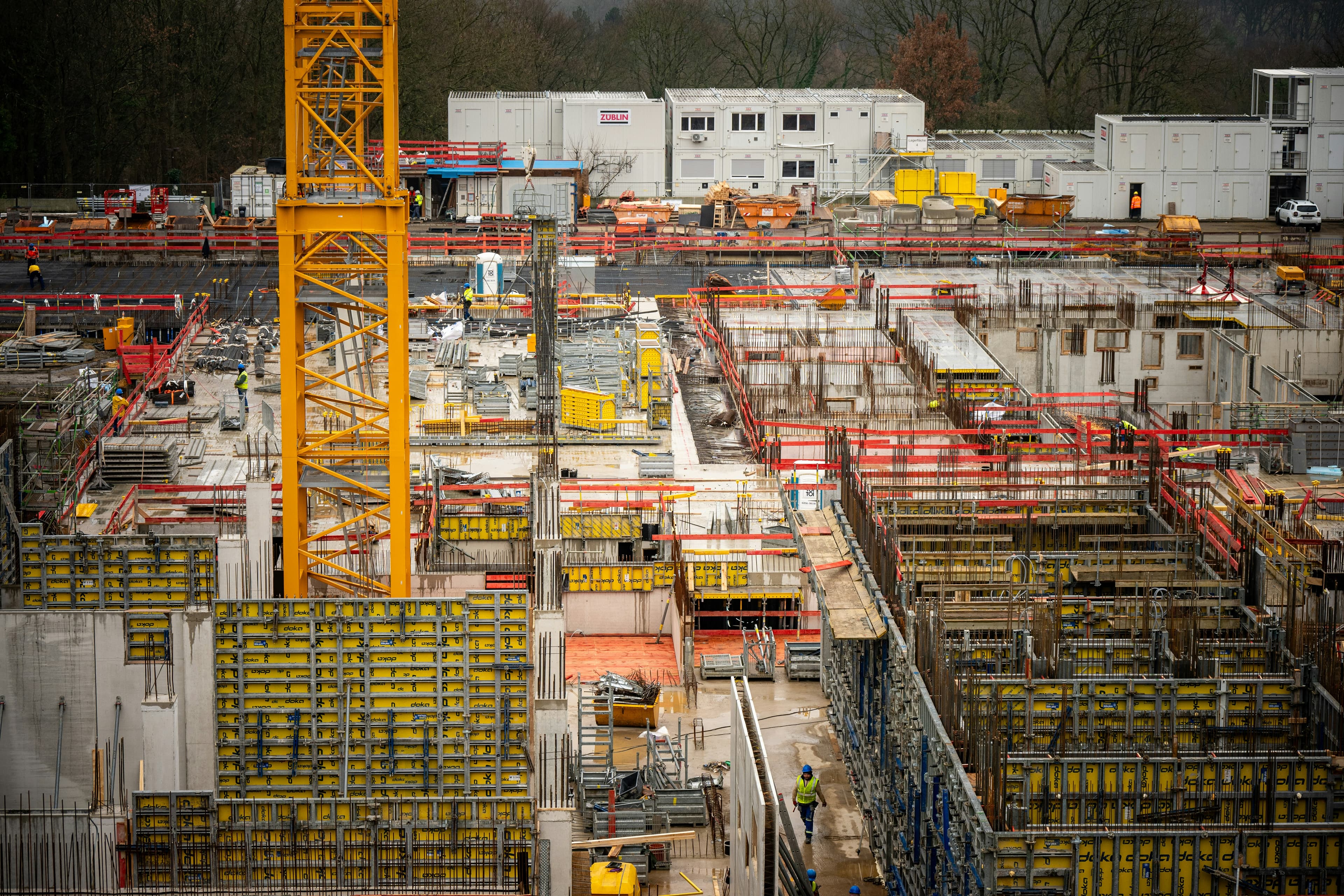Active construction site with crane and formwork