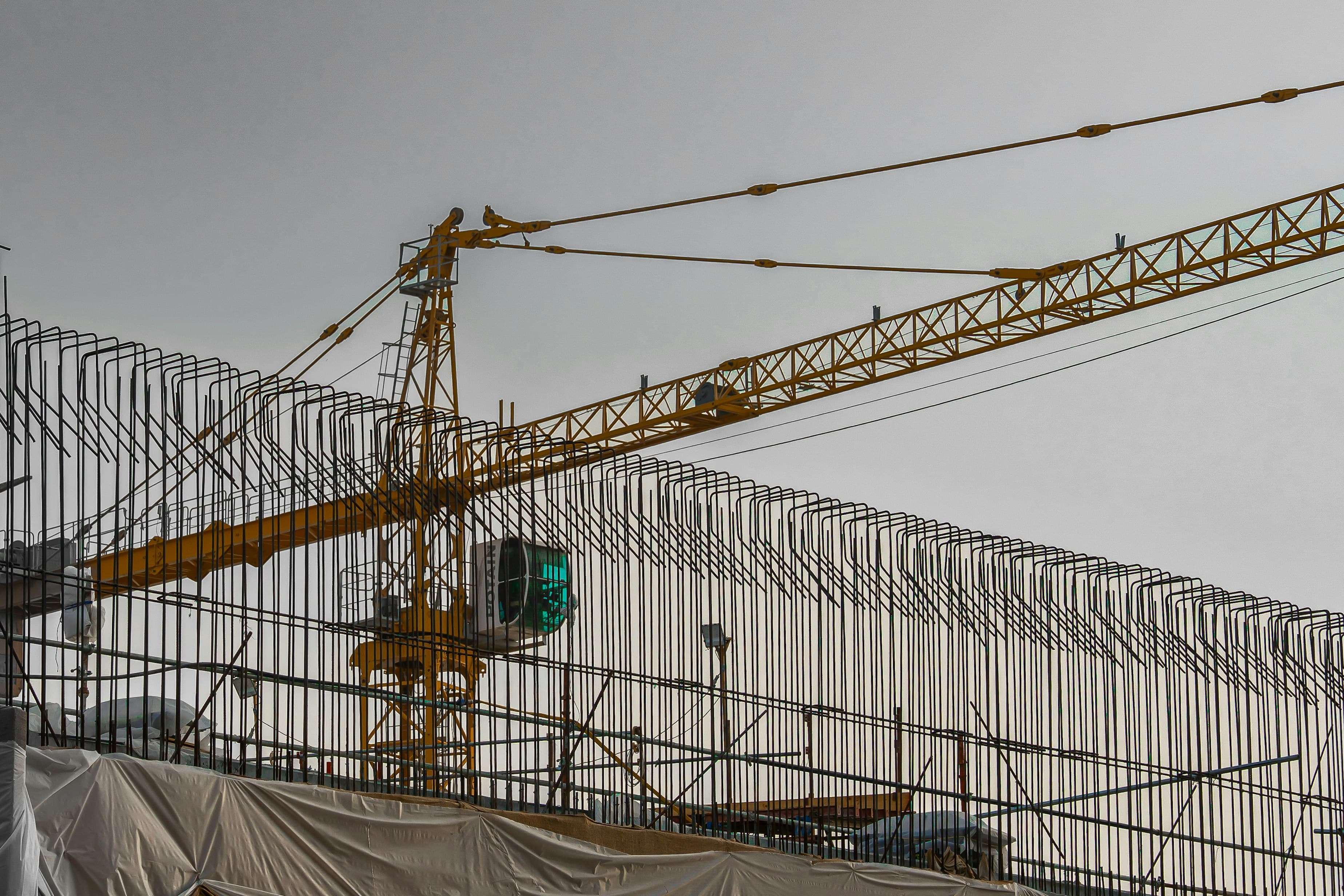 Steel reinforcement and crane on construction site